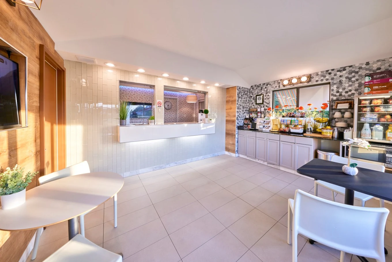 Regency Inn boutique motel exterior and breakfast area in Eddyville, KY